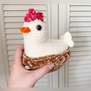Amigurumi crochet hen in nest
